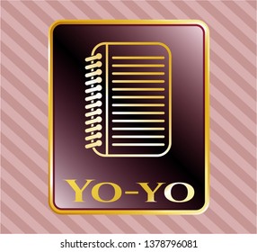  Gold emblem with note book icon and Yo-yo text inside