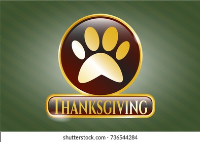  Gold emblem with paw icon and Thanksgiving text inside