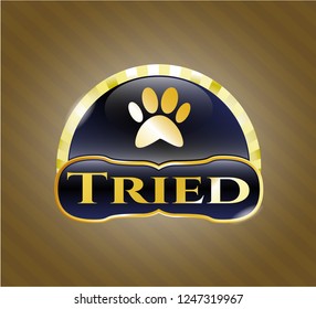  Gold emblem with paw icon and Tried text inside