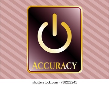  Gold emblem with power icon and Accuracy text inside
