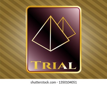 Gold emblem with pyramids icon and Trial text inside