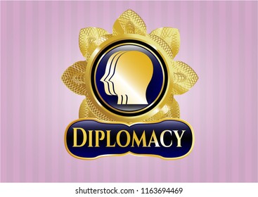  Gold emblem with team work icon and Diplomacy text inside