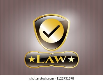  Gold emblem with tick icon and Law text inside