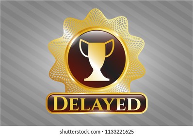  Gold emblem with trophy icon and Delayed text inside