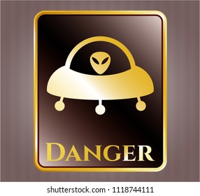  Gold emblem with ufo with aline inside icon and Danger text inside