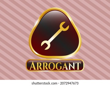 Gold Emblem With Wrench Icon And Arrogant Text Inside