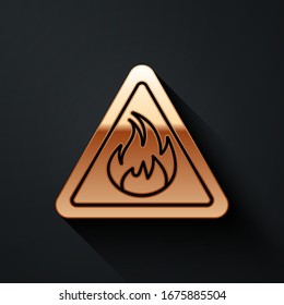Gold Fire flame in triangle icon isolated on black background. Warning sign of flammable product. Long shadow style. Vector Illustration