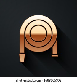 Gold Fire hose reel icon isolated on black background. Long shadow style. Vector Illustration