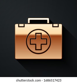 Gold First aid kit icon isolated on black background. Medical box with cross. Medical equipment for emergency. Healthcare concept. Long shadow style. Vector Illustration