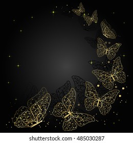 Gold flying butterflies on dark background with place for your text.