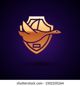 Gold Flying duck on shield icon isolated on dark blue background. Hunting trophy on wall.  Vector Illustration