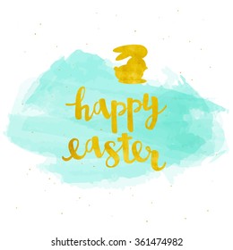 Gold foil Happy Easter  typography brush lettering with silhouette of a rabbit. Background with watercolor brush strokes and ink spots
