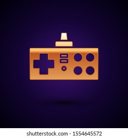 Gold Gamepad icon isolated on dark blue background. Game controller.  Vector Illustration