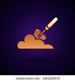 Gold Garden trowel spade or shovel in the ground icon isolated on dark blue background. Gardening tool. Tool for horticulture, agriculture, farming.  Vector Illustration