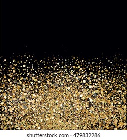 Gold glitter against black background