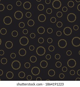 gold glitter circles on a black background pattern seamless.Modern abstract design for cover, paper,fabric, for holiday packaging, wrapping.Pattern Of Golden Circles On Black.Pattern for chistmas,xmas