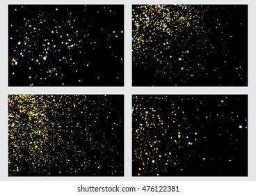 Gold glitter explosion set on black background made of spray paint. Collection of golden festive blow texture of confetti. Golden grunge grainy spray abstract texture of snowflakes. Winter Holiday.