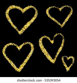 Gold glitter hearts isolated over black background. Happy Valentines Day golden glamour design elements.