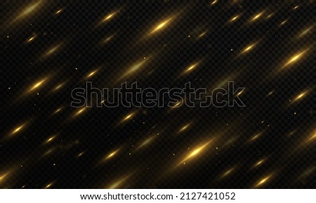 Gold glitter particles on background. Christmas light affect. The dust sparks and golden stars shine with special light.