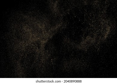 Gold Glitter Texture Isolated on Black Background. Golden stardust. Amber Particles Color. Sparkles Rain. Vector Illustration, Eps 10.