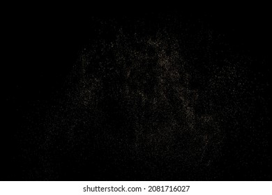 Gold Glitter Texture Isolated on Black Background. Golden stardust. Amber Particles Color. Sparkles Rain. Vector Illustration, Eps 10.