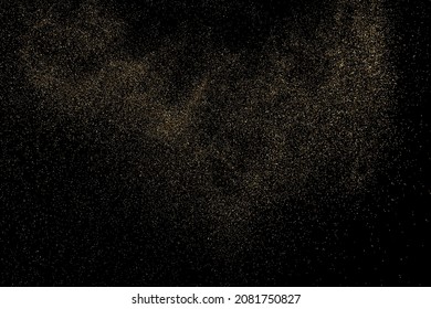 Gold Glitter Texture Isolated on Black Background. Golden stardust. Amber Particles Color. Sparkles Rain. Vector Illustration, Eps 10.