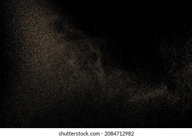 Gold Glitter Texture Isolated on Black Background. Golden stardust. Amber Particles Color. Sparkles Rain. Vector Illustration, Eps 10.