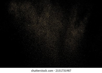 Gold Glitter Texture Isolated on Black Background. Golden stardust. Amber Particles Color. Sparkles Rain. Vector Illustration, Eps 10.