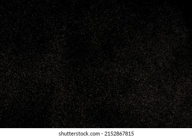 Gold Glitter Texture Isolated on Black Background. Golden stardust. Amber Particles Color. Sparkles Rain. Vector Illustration, Eps 10.