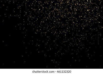 Gold glitter texture isolated on black. Celebratory background. Golden explosion of confetti. Vector illustration,eps 10.
