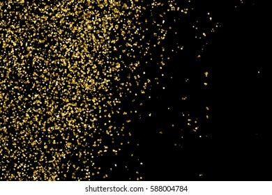 Gold glitter texture isolated on black. Amber particles color. Celebratory background. Golden explosion of confetti. Vector illustration,eps 10.