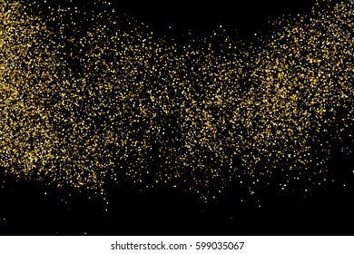 Gold glitter texture isolated on black. Amber particles color. Celebratory background. Golden explosion of confetti 