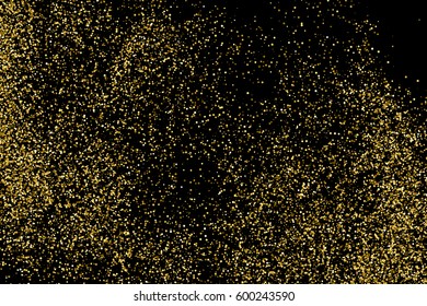 Gold glitter texture isolated on black. Amber particles color. Celebratory background. Golden explosion of confetti. 