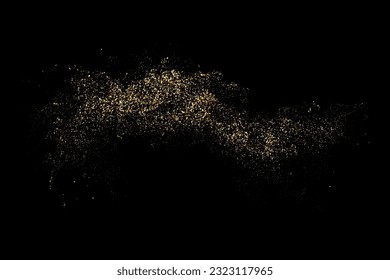 Gold glitter texture on black background. Explosion of golden particles.Festive background. Design element
