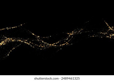Gold glitter texture on a black background. Wave-like streams of golden-colored particles, an explosion of sparkling confetti. Festive background.