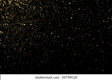 Gold glitter texture on a black background. Holiday background. Golden explosion of confetti. Golden grainy abstract  texture on a black  background. Design element. Vector illustration,eps 10.