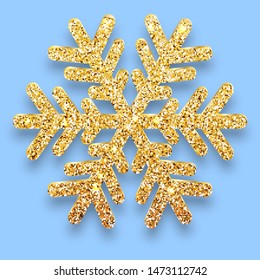 Gold glitter textured six-rayed snowflake isolated on blue background. Golden Christmas Snow flake  