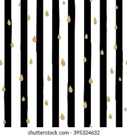 Gold glittering drops seamless pattern on striped background