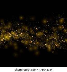 Gold glittering star dust trail sparkling particles on black background. Magical glowing space comet tail. Vector glamour fashion illustration