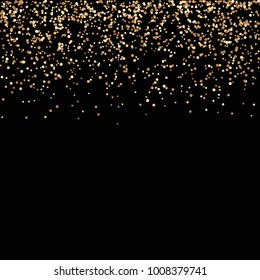 Gold glitters on a black background.Confetti falling gold glitter.