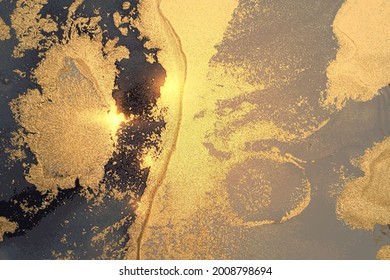 Gold, gray and dark blue abstract marble pattern with sparkles. Vector background in alcohol ink technique with glitter. Template for banner, poster design. Fluid art painting