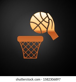 Gold Hand with basketball ball and basket icon isolated on black background. Ball in basketball hoop.  Vector Illustration