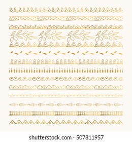 Gold hand drawn borders and dividers. Ink and brush vector illustration.