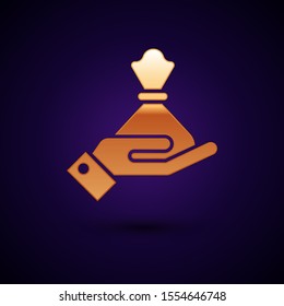 Gold Hand holding money bag icon isolated on dark blue background. Dollar or USD symbol. Cash Banking currency sign.  Vector Illustration