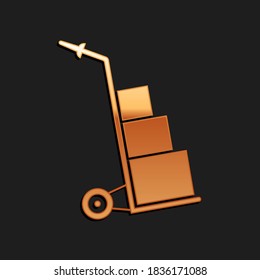 Gold Hand truck and boxes icon isolated on black background. Dolly symbol. Long shadow style. Vector.