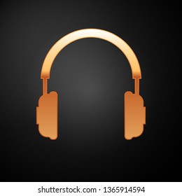 Gold Headphones icon isolated on black background. Earphones sign. Concept object for listening to music, service, communication and operator. Vector Illustration