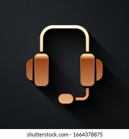 Gold Headphones icon isolated on black background. Support customer service, hotline, call center, faq, maintenance. Long shadow style. Vector Illustration