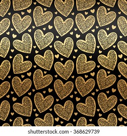 Gold hearts seamless vector pattern. Glittering golden and black Valentine's Day background. Endless texture made of ornamental hearts of various size. Gold foil hearts with lacy ornamentation.