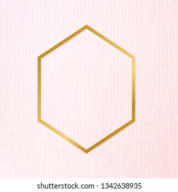 Gold hexagon frame on a pinkish blue fabric background vector