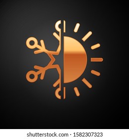 Gold Hot and cold symbol. Sun and snowflake icon isolated on black background. Winter and summer symbol.  Vector Illustration